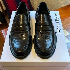 JW Anderson black logo loafers
